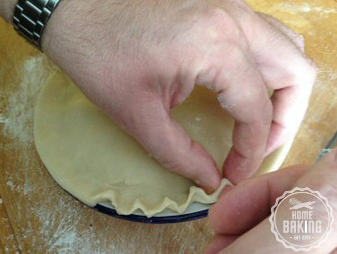 crimping the pastry with thumband fore finger